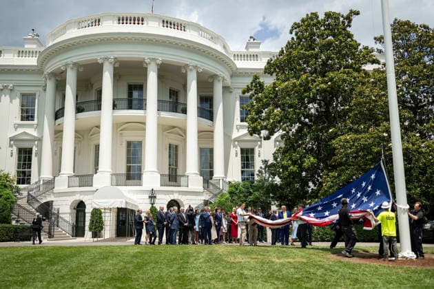 October 5, 2026, Washington, Dc, United States of America: An American flag is raised on a newly installed flagpole on the South Lawn of the White House as U.S. President Donald Trump, family members and guests look on, June 18, 2025 in Washington, D.C. The flag was raised on one of two new flagpoles Trump had installed on the North and South Lawns of the White House, which he said he paid for personally. Washington United States of America - ZUMAp138 20261005_zaa_p138_046 Copyright: xDanielxTorok WhitexHousex