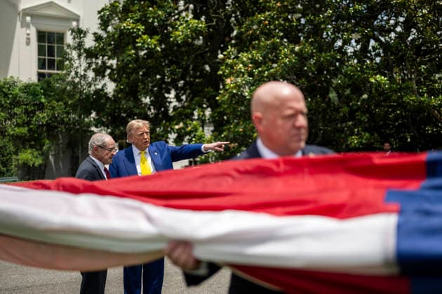 October 5, 2026, Washington, Dc, United States of America: U.S. President Donald Trump points as workers unfurl an American flag to be raised on a newly installed flagpole on the South Lawn of the White House, June 18, 2025 in Washington, D.C. The flag was raised on one of two new flagpoles Trump had installed on the North and South Lawns of the White House, which he said he paid for personally. Washington United States of America - ZUMAp138 20261005_zaa_p138_048 Copyright: xDanielxTorok WhitexHousex