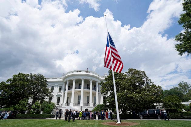 October 5, 2026, Washington, Dc, United States of America: An American flag flies from a newly installed flagpole on the South Lawn of the White House as guests gather below, June 18, 2025 in Washington, D.C. The flag was raised on one of two new flagpoles Trump had installed on the North and South Lawns of the White House, which he said he paid for personally. Washington United States of America - ZUMAp138 20261005_zaa_p138_051 Copyright: xAndreaxHanks WhitexHousex
