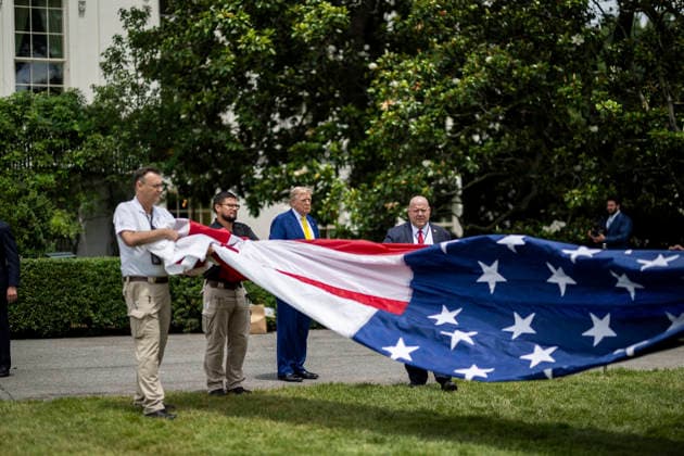 October 5, 2026, Washington, Dc, United States of America: U.S. President Donald Trump watches as workers unfurl an American flag to be raised on a newly installed flagpole on the South Lawn of the White House, June 18, 2025 in Washington, D.C. The flag was raised on one of two new flagpoles Trump had installed on the North and South Lawns of the White House, which he said he paid for personally. Washington United States of America - ZUMAp138 20261005_zaa_p138_055 Copyright: xDanielxTorok WhitexHousex