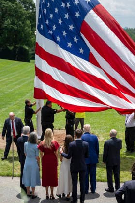 October 5, 2026, Washington, Dc, United States of America: An American flag is raised on a newly installed flagpole on the South Lawn of the White House as U.S. President Donald Trump, family members and guests look on, June 18, 2025 in Washington, D.C. The flag was raised on one of two new flagpoles Trump had installed on the North and South Lawns of the White House, which he said he paid for personally. Washington United States of America - ZUMAp138 20261005_zaa_p138_069 Copyright: xMollyxRiley WhitexHousex