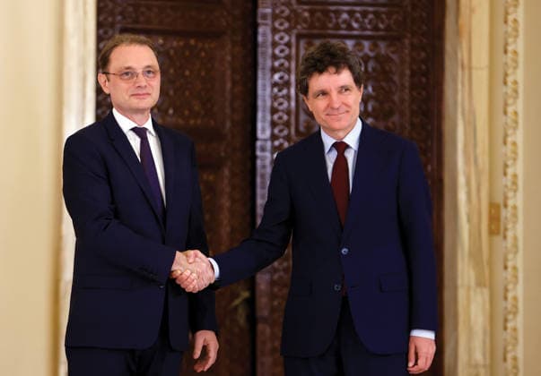 (261005) -- BUCHAREST, Oct. 5, 2026 -- Romanian President Nicusor Dan (R) shakes hands with Luca Niculescu at a press conference in Bucharest, Romania, Oct. 5, 2026. Nicusor Dan designated Luca Niculescu, state secretary at the Ministry of Foreign Affairs, to form the government on Monday evening, according to Romania s national news agency Agerpres. (Photo by Xinhua) ROMANIA-BUCHAREST-PM-NOMINATION CristianxCristel 