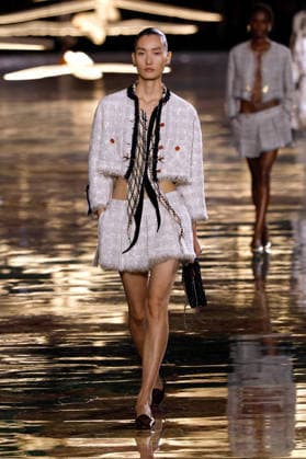 (261006) -- PARIS, Oct. 6, 2026 -- A model presents a creation from the Womenswear Spring Summer 2027 collections by Chanel during the Paris Fashion Week in Paris, France, Oct. 5, 2026. ( Handout via Xinhua) FRANCE-PARIS-FASHION WEEK-CHANEL MeetEurope 