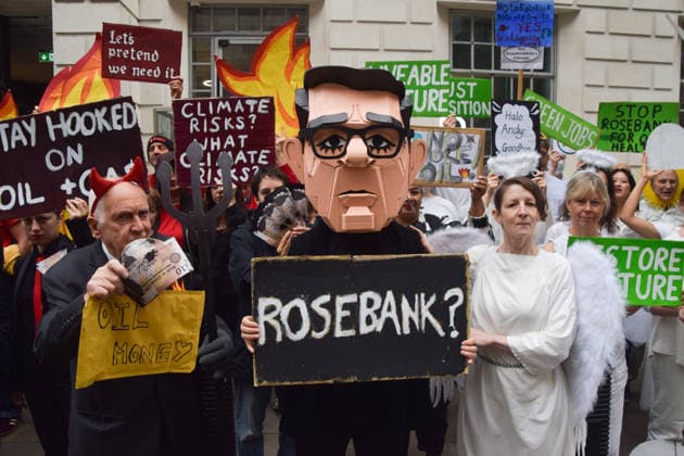 October 6, 2026, London, England, United Kingdom: Activists from the group Fossil Free London stage a protest against the Rosebank oil field and the Jackdaw gas field outside the Department for Energy Security and Net Zero. Activists dressed as angels urge a protester wearing an Andy Burnham mask to stop the fossil fuel projects in the North Sea while activists dressed as demons urge him to drill for more oil. London United Kingdom  - ZUMAv130 20261006_zip_v130_005 Copyright: xVukxValcicx