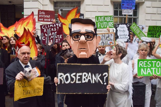 October 6, 2026, London, England, United Kingdom: Activists from the climate action group Fossil Free London stage a protest against the Rosebank oil field and the Jackdaw gas field outside the Department for Energy Security and Net Zero. Activists dressed as angels urge a protester wearing an Andy Burnham mask to stop the fossil fuel projects in the North Sea while activists dressed as demons urge him to drill for more oil. London United Kingdom  - ZUMAv130 20261006_zip_v130_015 Copyright: xVukxValcicx