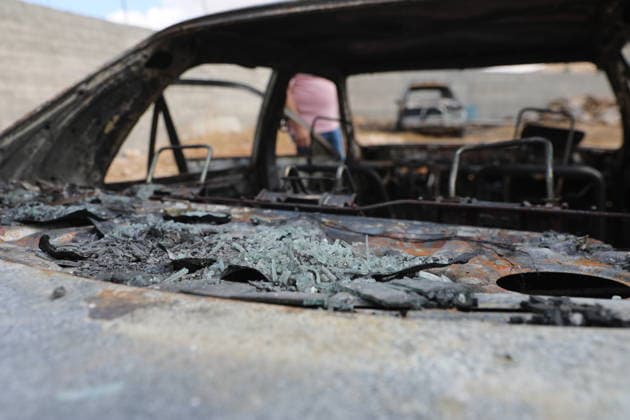 Palestinian Inspects Burned Vehicles Near al-Samu South of Hebron A Palestinian man inspects his burned vehicles near the town of al-Samu, south of Hebron, in the West Bank, on October 6, 2026, after an apparent arson attack believed to have been carried out by Israeli settlers. The incident comes amid an increase in settler attacks on Palestinians and their property in different areas of the West Bank. Photo by Mamoun Wazwaz apaimages Hebron West Bank Palestinian Territory 061026_Hebron_MW_00(4) Copyright: xapaimagesxMamounxWazwazx xapaimagesx