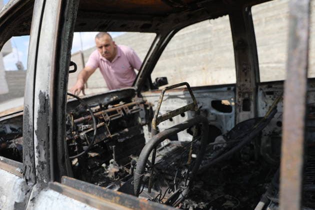 Palestinian Inspects Burned Vehicles Near al-Samu South of Hebron A Palestinian man inspects his burned vehicles near the town of al-Samu, south of Hebron, in the West Bank, on October 6, 2026, after an apparent arson attack believed to have been carried out by Israeli settlers. The incident comes amid an increase in settler attacks on Palestinians and their property in different areas of the West Bank. Photo by Mamoun Wazwaz apaimages Hebron West Bank Palestinian Territory 061026_Hebron_MW_00(11) Copyright: xapaimagesxMamounxWazwazx xapaimagesx