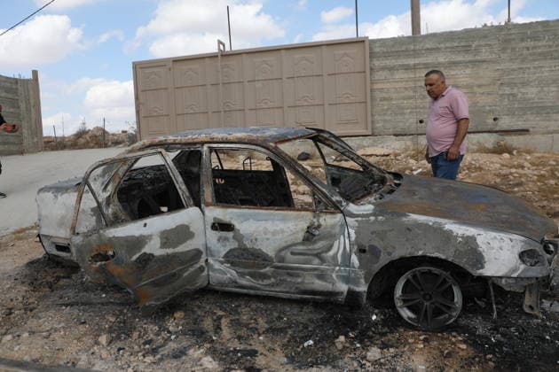 Palestinian Inspects Burned Vehicles Near al-Samu South of Hebron A Palestinian man inspects his burned vehicles near the town of al-Samu, south of Hebron, in the West Bank, on October 6, 2026, after an apparent arson attack believed to have been carried out by Israeli settlers. The incident comes amid an increase in settler attacks on Palestinians and their property in different areas of the West Bank. Photo by Mamoun Wazwaz apaimages Hebron West Bank Palestinian Territory 061026_Hebron_MW_00(17) Copyright: xapaimagesxMamounxWazwazx xapaimagesx