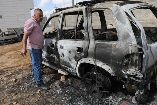 Palestinian Inspects Burned Vehicles Near al-Samu South of Hebron A Palestinian man inspects his burned vehicles near the town of al-Samu, south of Hebron, in the West Bank, on October 6, 2026, after an apparent arson attack believed to have been carried out by Israeli settlers. The incident comes amid an increase in settler attacks on Palestinians and their property in different areas of the West Bank. Photo by Mamoun Wazwaz apaimages Hebron West Bank Palestinian Territory 061026_Hebron_MW_00(13) Copyright: xapaimagesxMamounxWazwazx xapaimagesx