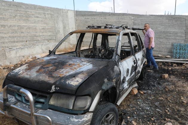 Palestinian Inspects Burned Vehicles Near al-Samu South of Hebron A Palestinian man inspects his burned vehicles near the town of al-Samu, south of Hebron, in the West Bank, on October 6, 2026, after an apparent arson attack believed to have been carried out by Israeli settlers. The incident comes amid an increase in settler attacks on Palestinians and their property in different areas of the West Bank. Photo by Mamoun Wazwaz apaimages Hebron West Bank Palestinian Territory 061026_Hebron_MW_00(5) Copyright: xapaimagesxMamounxWazwazx xapaimagesx