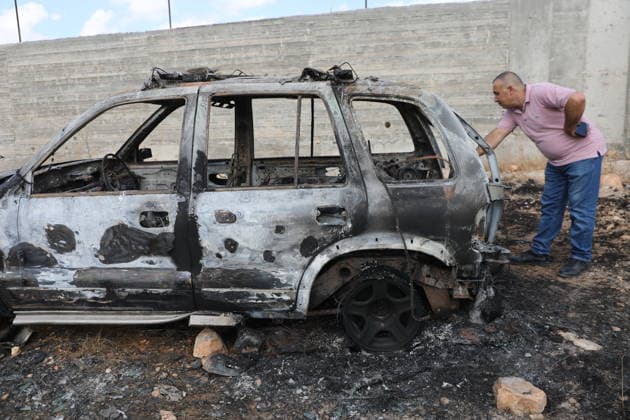 Palestinian Inspects Burned Vehicles Near al-Samu South of Hebron A Palestinian man inspects his burned vehicles near the town of al-Samu, south of Hebron, in the West Bank, on October 6, 2026, after an apparent arson attack believed to have been carried out by Israeli settlers. The incident comes amid an increase in settler attacks on Palestinians and their property in different areas of the West Bank. Photo by Mamoun Wazwaz apaimages Hebron West Bank Palestinian Territory 061026_Hebron_MW_00(7) Copyright: xapaimagesxMamounxWazwazx xapaimagesx
