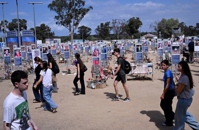 Israeli. youth look at photos of hundreds of victims killed by Hamas on October 7, 2023, at the Nova Festival Memorial site in Re im, near the Gaza border on Monday, October 6, 2026. Israel is marking three years since the Hamas attack that killed 1,200 people and 251 were taken hostage into Gaza.  JER2026100607 DEBBIExHILL