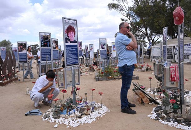 People mourn victims killed by Hamas on October 7, 2023, at the Nova Festival Memorial site in Re im, near the Gaza border on Monday, October 6, 2026. Israel is marking three years since the Hamas attack that killed 1,200 people and 251 were taken hostage into Gaza.  JER2026100611 DEBBIExHILL