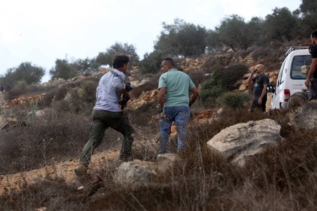 Palestinian farmers wounded in settler attack near Nablus AQRABA, OCCUPIED WEST BANK, OCTOBER 6, 2026: Palestinian farmers come under attack by Israeli settlers while harvesting olives in the village of Aqraba, south of Nablus. Several Palestinians were wounded after settlers opened fire and assaulted farmers during the harvest, according to Palestinian reports. Israeli forces later detained a Palestinian farmer at the scene, according to information provided by the photographer. The Israeli military had not immediately commented on the reported shooting. AQRABA Palestine, State of Copyright: x xNedalxShtiehx xJNAxPressx
