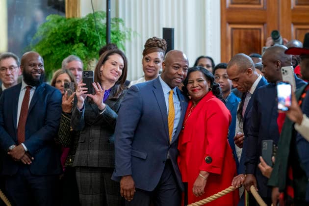 October 6, 2026, Washington, Dc, United States: U.S Senator Tim Scott, R-SC, center, embraces criminal rights advocate Alice Johnson, right, as Secretary of Agriculture Brooke Rollins, left, looks on during a Black History Month event at the East Room of the White House, February 20, 2025 in Washington, D.C. Washington United States - ZUMAp138 20261006_zaa_p138_005 Copyright: xMollyxRiley WhitexHousex