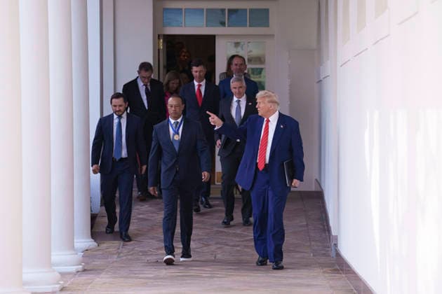 October 6, 2026, Washington, Dc, United States of America: U.S. President Donald Trump walks with golfer Tiger Woods along the West Colonnade of the White House before a reception honoring Black History Month, February 20, 2025 in Washington, D.C. Woods, who received the Presidential Medal of Freedom from Trump in 2019, joined PGA Tour leaders at the White House for talks on a proposed deal with Saudi ArabiaÃ¢â‚¬â ¢s Public Investment Fund before Trump introduced him as a surprise guest at a Black History Month reception. Washington United States of America - ZUMAp138 20261006_zaa_p138_006 Copyright: xJoycexBoghosian WhitexHousex