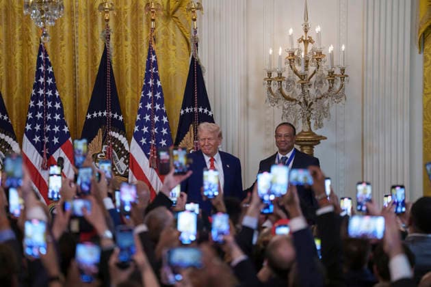 October 6, 2026, Washington, Dc, United States of America: Guests raise their phones as U.S. President Donald Trump and golfer Tiger Woods appear at a reception honoring Black History Month in the East Room of the White House, February 20, 2025 in Washington, D.C. Trump introduced golfer Tiger Woods as a surprise guest at the reception in the East Room, where he praised Woods as one of the greatest athletes of all time. Washington United States of America - ZUMAp138 20261006_zaa_p138_011 Copyright: xJoycexBoghosian WhitexHousex