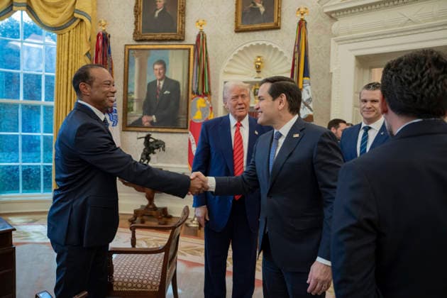 October 6, 2026, Washington, Dc, United States of America: Golfer Tiger Woods shakes hands with an official as U.S. President Donald Trump looks on in the Oval Office of the White House, February 20, 2025 in Washington, D.C. Woods, who received the Presidential Medal of Freedom from Trump in 2019, joined PGA Tour leaders at the White House for talks on a proposed deal with Saudi ArabiaÃ¢â‚¬â ¢s Public Investment Fund before Trump introduced him as a surprise guest at a Black History Month reception. Washington United States of America - ZUMAp138 20261006_zaa_p138_013 Copyright: xJoycexN.xBoghosian WhitexHousex