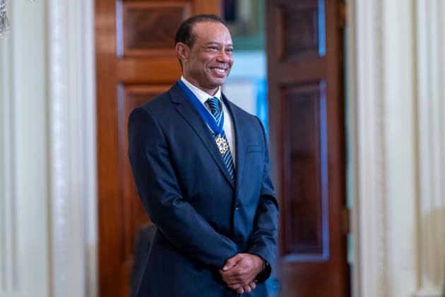 October 6, 2026, Washington, Dc, United States of America: Golfer Tiger Woods smiles as he is introduced by U.S. President Donald Trump at a reception honoring Black History Month in the East Room of the White House, February 20, 2025 in Washington, D.C. Trump introduced golfer Tiger Woods as a surprise guest at the reception in the East Room, where he praised Woods as one of the greatest athletes of all time. Washington United States of America - ZUMAp138 20261006_zaa_p138_014 Copyright: xMollyxRiley WhitexHousex