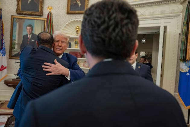October 6, 2026, Washington, Dc, United States of America: U.S. President Donald Trump embraces a guest in the Oval Office of the White House during a visit by golfer Tiger Woods, February 20, 2025 in Washington, D.C. Woods, who received the Presidential Medal of Freedom from Trump in 2019, joined PGA Tour leaders at the White House for talks on a proposed deal with Saudi ArabiaÃ¢â‚¬â ¢s Public Investment Fund before Trump introduced him as a surprise guest at a Black History Month reception. Washington United States of America - ZUMAp138 20261006_zaa_p138_023 Copyright: xJoycexN.xBoghosian WhitexHousex