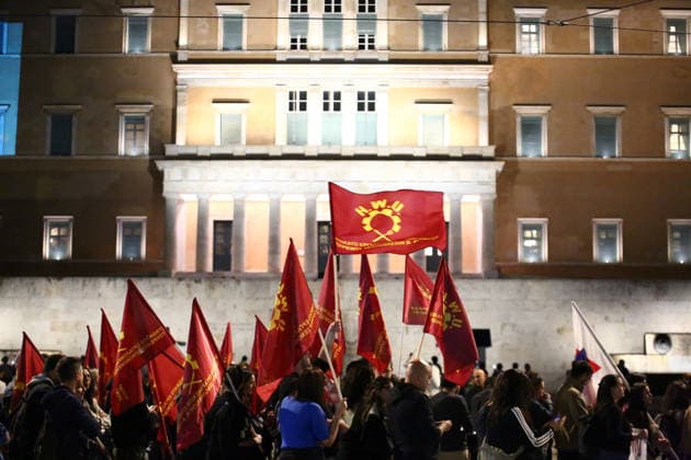 October 6, 2026, Athens, Attica, GREECE: Members of the Hotels Workers Union (HWU) hold union flags in front of the Greek Parliament during an anti-war protest opposing the visit of US Secretary of State MARCO RUBIO. Athens GREECE - ZUMAx103 20261006_zip_x103_008 Copyright: xHarrisxXanthopoulosx
