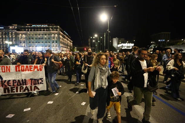 October 6, 2026, Athens, Attica, GREECE: A woman and a child walk among demonstrators during an anti-war protest opposing the visit of US Secretary of State MARCO RUBIO. Athens GREECE - ZUMAx103 20261006_zip_x103_011 Copyright: xHarrisxXanthopoulosx