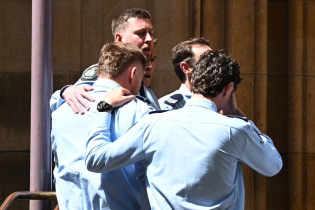MIA LAY FUNERAL, Daniel Vasquez (left) the partner of Mia Lay, is comforted by fellow pallbearers during the funeral service for NSW Police Constable Mia Lay at St Andrew s Cathedral, in Sydney, Wednesday, October 7, 2026. Constable Mia Lay, 20, died when the marked vehicle she was a passenger in crashed into a tree early on September 25 in the Sydney suburb of Redfern. ( NO ARCHIVING SYDNEY NEW SOUTH WALES Australia  Copyright: xDANxHIMBRECHTSx 20261007116481982480