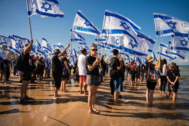 October 7, 2026, Tel Aviv, Tel Aviv, Israel: Activists carry flags at the beach in protest against the Israeli government on the third anniversary of October 7th. Tel Aviv Israel - ZUMAg280 20261007_znp_g280_009 Copyright: xYoavxGinsburgx