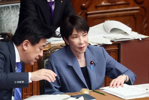 October 7, 2026, Tokyo, Japan - Japanese Prime Minister Sanae Takaichi (R) listens to Chief Cabinet Secretary Minoru Kihara (L) at Lower House s plenary session at the National Diet in Tokyo on Wednesday, October 7, 2026. (photo by Yoshio Tsunoda AFLO)  aflo_354016950