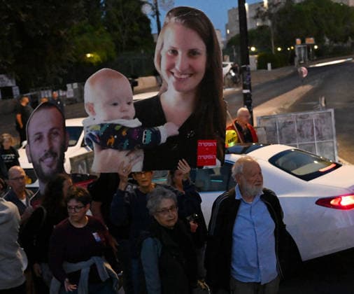 Families and supporters hold placards of faces of Israelis murdered by Hamas during a protest on the third anniversary of the deadliest day in Israel s history outside the Israeli Knesset, Parliament, in Jerusalem, on Wednesday, October 7, 2026. Demonstrators demand a state independent inquiry into the government s security failures, a request rejected by Israeli Prime Minister Benjamin Netanyahu. The banner reads The people shall remember their sons and daughters who were murdered a reference to the Yizkor prayer, with the date 27 10, the day of the upcoming general elections in Israel that are seen as a referendum on Netanyahu s power.  JER2026100702 DEBBIExHILL