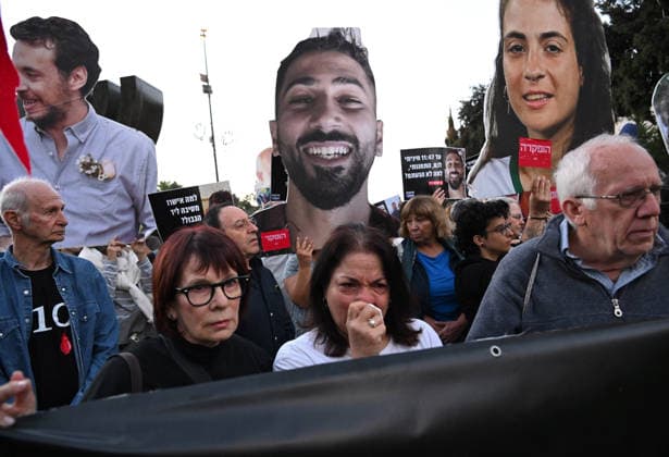 Families and supporters hold placards of faces of Israelis murdered by Hamas during a protest on the third anniversary of the deadliest day in Israel s history outside the Israeli Knesset, Parliament, in Jerusalem, on Wednesday, October 7, 2026. Demonstrators demand a state independent inquiry into the government s security failures, a request rejected by Israeli Prime Minister Benjamin Netanyahu. The banner reads The people shall remember their sons and daughters who were murdered a reference to the Yizkor prayer, with the date 27 10, the day of the upcoming general elections in Israel that are seen as a referendum on Netanyahu s power.  JER2026100707 DEBBIExHILL