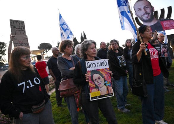 Families and supporters hold placards of faces of Israelis murdered by Hamas during a protest on the third anniversary of the deadliest day in Israel s history outside the Israeli Knesset, Parliament, in Jerusalem, on Wednesday, October 7, 2026. Demonstrators demand a state independent inquiry into the government s security failures, a request rejected by Israeli Prime Minister Benjamin Netanyahu. The banner reads The people shall remember their sons and daughters who were murdered a reference to the Yizkor prayer, with the date 27 10, the day of the upcoming general elections in Israel that are seen as a referendum on Netanyahu s power.  JER2026100713 DEBBIExHILL