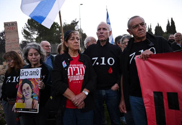 Families and supporters hold placards of faces of Israelis murdered by Hamas during a protest on the third anniversary of the deadliest day in Israel s history outside the Israeli Knesset, Parliament, in Jerusalem, on Wednesday, October 7, 2026. Demonstrators demand a state independent inquiry into the government s security failures, a request rejected by Israeli Prime Minister Benjamin Netanyahu. The banner reads The people shall remember their sons and daughters who were murdered a reference to the Yizkor prayer, with the date 27 10, the day of the upcoming general elections in Israel that are seen as a referendum on Netanyahu s power.  JER2026100716 DEBBIExHILL