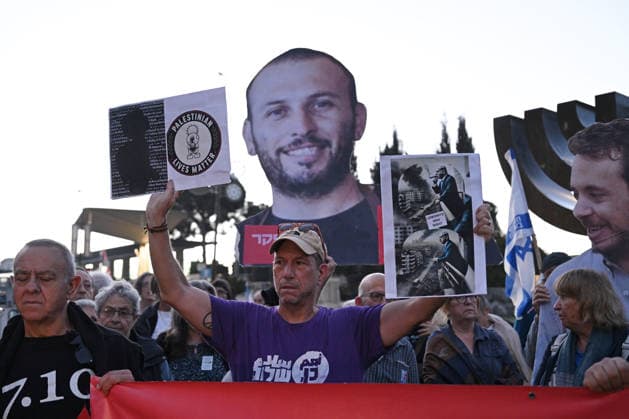 Families and supporters hold placards of faces of Israelis murdered by Hamas during a protest on the third anniversary of the deadliest day in Israel s history outside the Israeli Knesset, Parliament, in Jerusalem, on Wednesday, October 7, 2026. Demonstrators demand a state independent inquiry into the government s security failures, a request rejected by Israeli Prime Minister Benjamin Netanyahu. The banner reads The people shall remember their sons and daughters who were murdered a reference to the Yizkor prayer, with the date 27 10, the day of the upcoming general elections in Israel that are seen as a referendum on Netanyahu s power.  JER2026100718 DEBBIExHILL