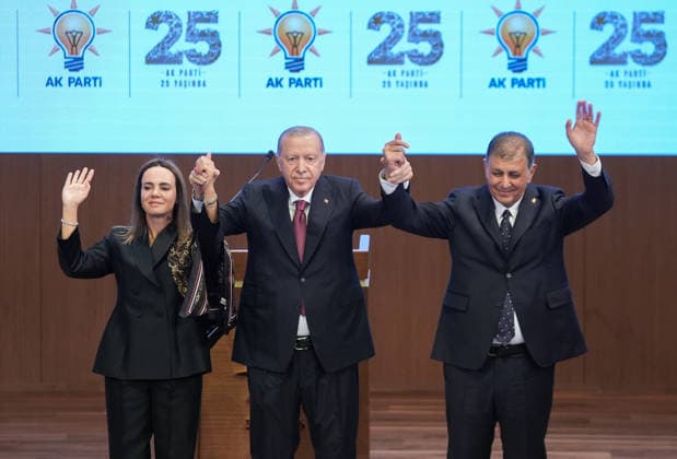 Legislative Year Opening Meeting with AK Party Deputies in Ankara ANKARA, TURKIYE - OCTOBER 07: Turkish President and Justice and Development (AK) Party Chairman Recep Tayyip Erdogan (C) poses for a photo after pinning a party badge on Izmir Metropolitan Municipality Mayor Cemil Tugay (R), who joined the AK Party, during the Legislative Year Opening Meeting with AK Party MPs at the AK Party Congress Center in Ankara, Turkiye on October 07, 2026. Ercin Erturk Anadolu Ankara Turkey. Editorial use only. Please get in touch for any other usage.  Copyright: x2026xAnadoluxErcinxErturkx