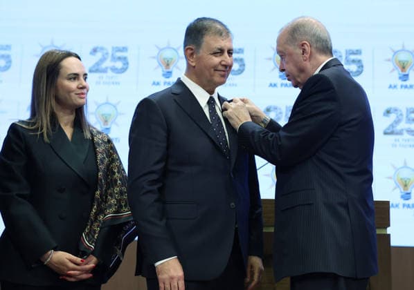 Legislative Year Opening Meeting with AK Party Deputies ANKARA, TURKIYE - OCTOBER 7: (----EDITORIAL USE ONLY - MANDATORY CREDIT - TURKISH PRESIDENCY MUSTAFA KAMACI HANDOUT - NO MARKETING NO ADVERTISING CAMPAIGNS - DISTRIBUTED AS A SERVICE TO CLIENTS----) Turkish President and Leader of the Justice and Development (AK) Party Recep Tayyip Erdogan (R) pins the party badge on Izmir Metropolitan Municipality Mayor Cemil Tugay (C), who joined the AK Party, as Tugay s wife Oznur Tugay (L) looks on during the Legislative Year Opening Meeting with AK Party Deputies at the AK Party Congress Center in Ankara, Turkiye on October 7, 2026. Turkish Presidency Mustafa Kamaci Handout Anadolu Ankara Turkey. Editorial use only. Please get in touch  Copyright: x2026xAnadoluxTurkishxPresidencyx xMustafaxKamacix xHandoutx