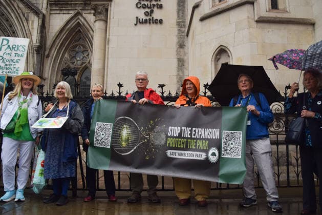 October 7, 2026, London, England, United Kingdom: Campaigners from Save Wimbledon Park gather outside the Royal Courts of Justice as they ask the Court of Appeal to overturn the permission for the All England Club to expand and build a new stadium and tennis courts on the Wimbledon Park golf course. London United Kingdom - ZUMAv130 20261007_zip_v130_014 Copyright: xVukxValcicx