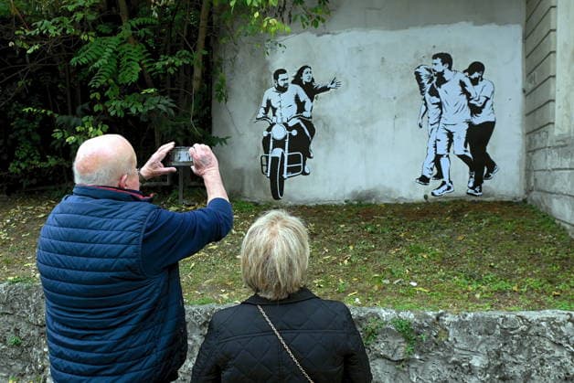 IPA89393690 - MILAN - October 7, 2026 - A mural by Alexandro Palombo, an artwork on display on October 7 at the Museum of Modern Art, located at 16 Via Palestro, dedicated to the young couple kidnapped during the attack on the Nova Music Festival  Copyright: xMaurizioxMaulex xMaurizioxMaulex IPA89393690