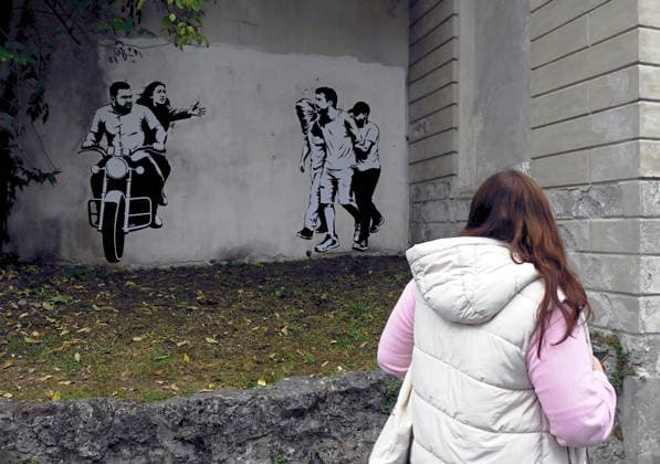 IPA89393684 - MILAN - October 7, 2026 - A mural by Alexandro Palombo, an artwork on display on October 7 at the Museum of Modern Art, located at 16 Via Palestro, dedicated to the young couple kidnapped during the attack on the Nova Music Festival  Copyright: xMaurizioxMaulex xMaurizioxMaulex IPA89393684