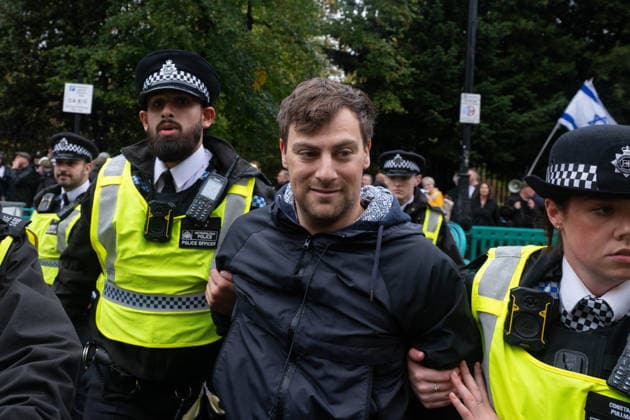 Pro-Palestinian protesters march In London LONDON, UNITED KINGDOM - OCTOBER 7: Police officers detain a Pro-Palestinian demonstrator during a protest in central London, United Kingdom, on October 7, 2026, marking the third anniversary of the October 7, 2023 attacks. Thomas Krych Anadolu London United Kingdom. Editorial use only. Please get in touch for any other usage.  Copyright: x2026xAnadoluxThomasxKrychx