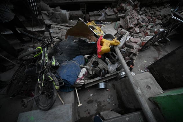NEW DELHI, INDIA - OCTOBER 7: Rubble after a four-storey residential building collapsed in the New Seemapuri area of Shahdara on October 7, 2026, in New Delhi, India. The structural collapse occurred around 3:30 PM behind the local fish market, trapping multiple residents under concrete slabs and damaging two adjoining houses. At least one minor died while eight people were rescued and rushed to Rajiv Gandhi Super Speciality Hospital for emergency medical treatment as sniffer dogs and excavators worked late into the evening to locate remaining trapped survivors. (Photo by Ishant Chauhan Hindustan Times) 3 Dead, Eight Injured In 5 Storey Building Collapses In New Seemapuri Of New Delhi