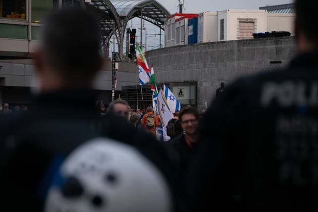 October 7, 2026, Cologne, Nrw, Germany: Multiple hundreds of people took part in a demonstration in Cologne marking the third anniversary of October 7, 2023, protesting IsraelÃ¢â‚¬â ¢s military campaign and genocidal intervention in Gaza. A smaller counter-protest took place without reported confrontations between the two groups...Police intervened and stopped the demonstration multiple times before protesters were held inside a police cage for approximately two hours. Officers later opened a corridor and allowed them to leave in small groups. During the dispersal, police arrested around 10 protesters, who were later released from custody. Cologne Germany  - ZUMAm356 20261007_zip_m356_003 Copyright: xMouafakxMahmaljix