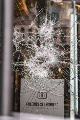 storefront window was damaged after a protest against education reforms and budget cuts, on Thursday 8 October 2026. For several days protests turned violent, mainly due to rioters who vandalize the city centre and face police. The city of Liege announced a ban of gathering of more than three minors on public space, unless with a responsible adult, to prevent the gathering of rioters who have nothing to do with the original movement.  BRUNOxFAHY 189130019