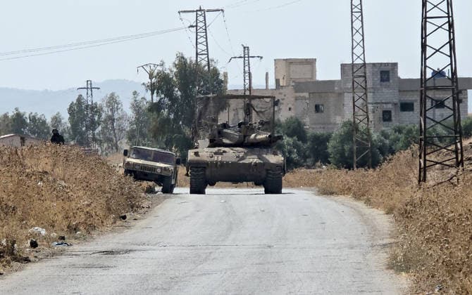 Israeli army conducts raids in Syria s Quneitra countryside QUNEITRA, SYRIA - OCTOBER 8: Israeli forces patrol the village with tanks as they conduct raids in residential areas and fire harassment shots at open areas in the countryside of Quneitra, southern Syria, on October 8, 2026. Huseyin Mesal Anadolu Quneitra Syria. Editorial use only. Please get in touch for any other usage.  Copyright: x2026xAnadoluxHuseyinxMesalx