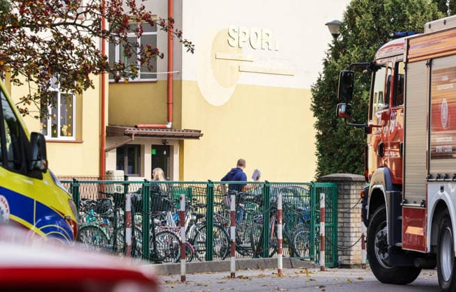 Stabbing attack at a primary school in Poland Photo: Wojciech Olkusnik East News Emergency services are seen at the site after a knife attack at the local primary school on October 8, 2026 in the village of Leszczydol-Nowiny in central Poland, approximately 60 km north-east of Warsaw. A 15-year-old school graduate entered the building armed with a knife and fatally stabbed the janitor and wounded two teachers trying to overpower him. According to the police the perpetrator was wearing a helmet with a camera and planned to record the attack. A day earlier a stabbing attack, where nine people were wounded, occurred in a vocational school in the town of Ostroleka, 50 km north of today s site. EN_01685559_0006 
