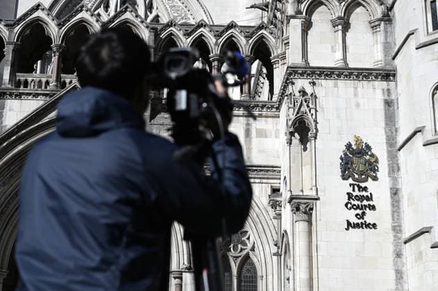 Royal Courts of Justice seen ahead of Andrew Mountbatten-Windsor s hearing LONDON, UNITED KINGDOM - OCTOBER 8: A cameraman films the Royal Courts of Justice, where a hearing is due to take place in Andrew Mountbatten-Windsor s legal challenge against search warrants related to his arrest over his alleged links to Jeffrey Epstein, in London, United Kingdom, on October 8, 2026. Rasid Necati Aslim Anadolu London United Kingdom. Editorial use only. Please get in touch for any other usage.  Copyright: x2026xAnadoluxRasidxNecatixAslimx