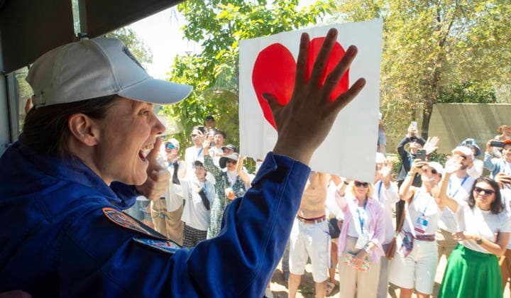 October 8, 2026, Baikonur, Kazakhstan: Baikonur, Kazakhstan. 14 July, 2026. Roscosmos cosmonaut Anna Kikina holds up a heart sign from the bus as she and crewmates Pyotr Dubrov and Anil Menon depart the Cosmonaut Hotel for suit-up, July 14, 2026 in Baikonur, Kazakhstan. The crew launched later that day to the International Space Station. Baikonur Kazakhstan - ZUMAp138 20261008_zaa_p138_003 Copyright: xPavelxShvets Gctcx