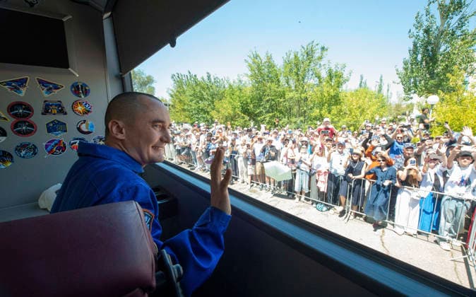 October 8, 2026, Baikonur, Kazakhstan: Baikonur, Kazakhstan. 14 July, 2026. Roscosmos cosmonaut Pyotr Dubrov waves from the bus as he and crewmates Anil Menon and Anna Kikina depart the Cosmonaut Hotel for suit-up, July 14, 2026 in Baikonur, Kazakhstan. The crew launched later that day to the International Space Station. Baikonur Kazakhstan - ZUMAp138 20261008_zaa_p138_005 Copyright: xPavelxShvets Gctcx