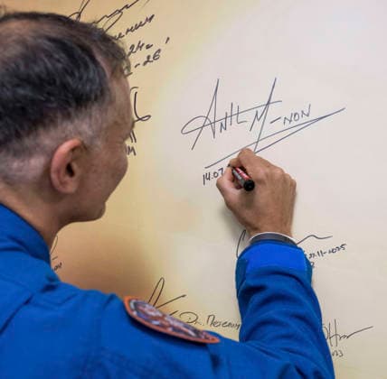 October 8, 2026, Baikonur, Kazakhstan: Baikonur, Kazakhstan. 14 July, 2026. NASA astronaut Anil Menon signs a mural at the Cosmonaut Hotel before departing for suit-up and launch, July 14, 2026 in Baikonur, Kazakhstan. Signing the mural is a preflight tradition. Baikonur Kazakhstan - ZUMAp138 20261008_zaa_p138_022 Copyright: xBillxIngalls Nasax