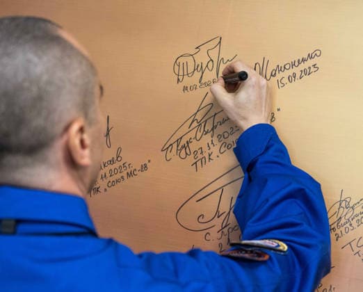 October 8, 2026, Baikonur, Kazakhstan: Baikonur, Kazakhstan. 14 July, 2026. Roscosmos cosmonaut Pyotr Dubrov signs a mural at the Cosmonaut Hotel before departing for suit-up and launch, July 14, 2026 in Baikonur, Kazakhstan. Signing the mural is a preflight tradition. Baikonur Kazakhstan - ZUMAp138 20261008_zaa_p138_039 Copyright: xBillxIngalls Nasax